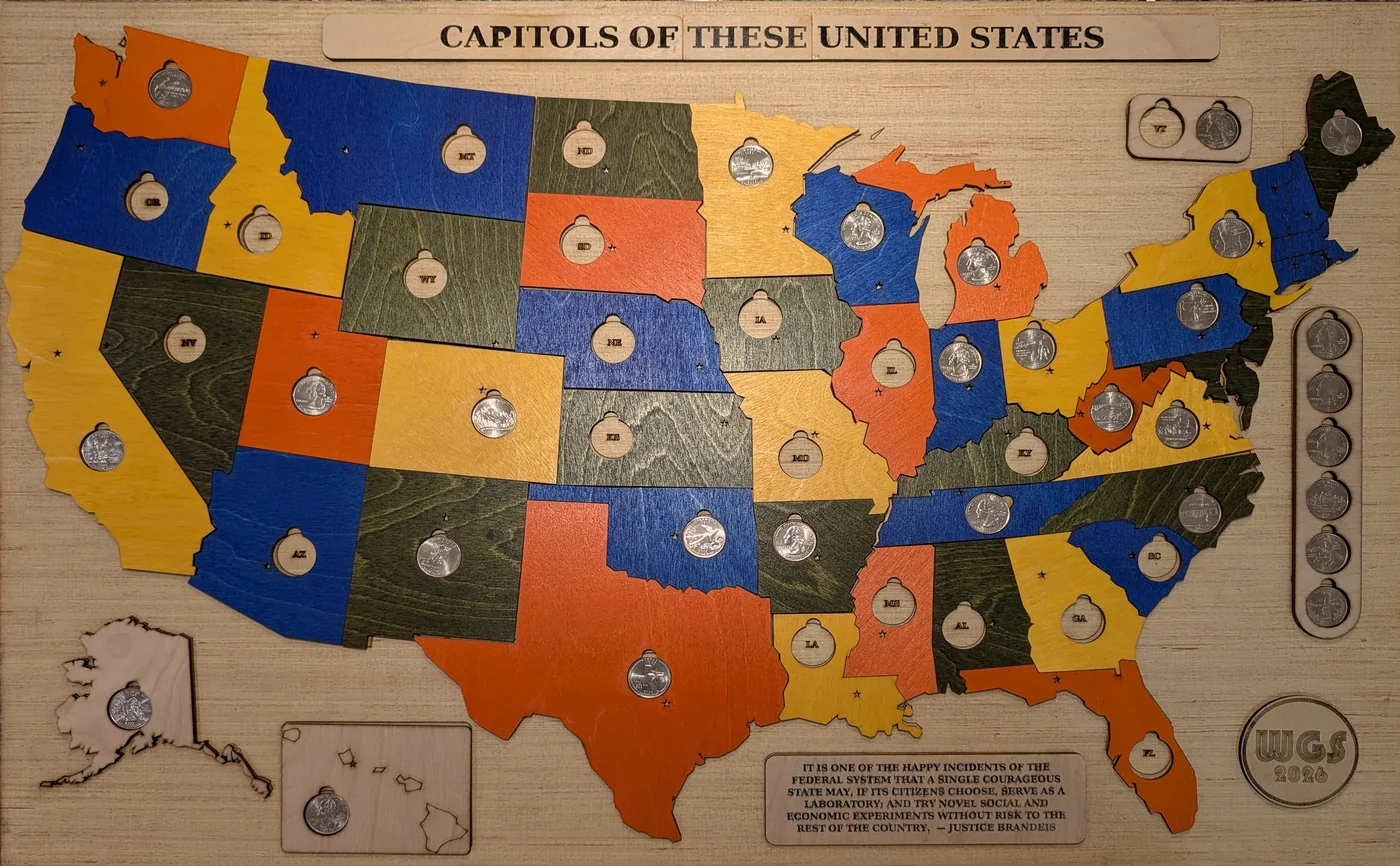 A laser-cut map of the United States, each state cut from plywood, stained, and holding its commemorative quarter